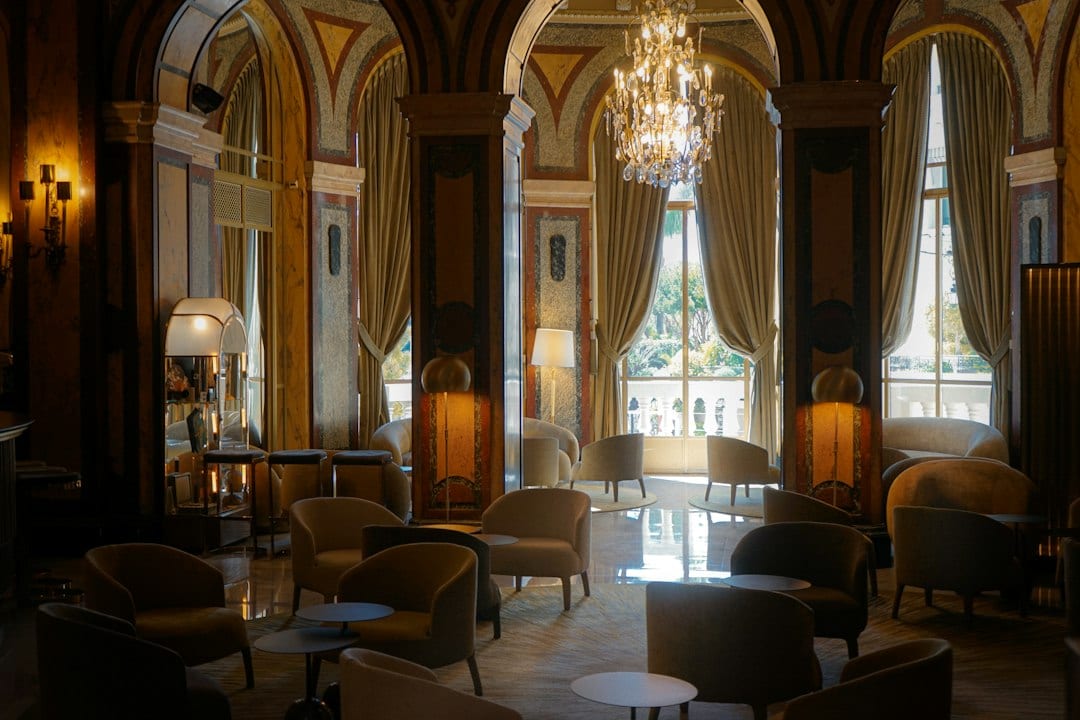 Boutique hotel lobby with warm lighting and refined soft decoration